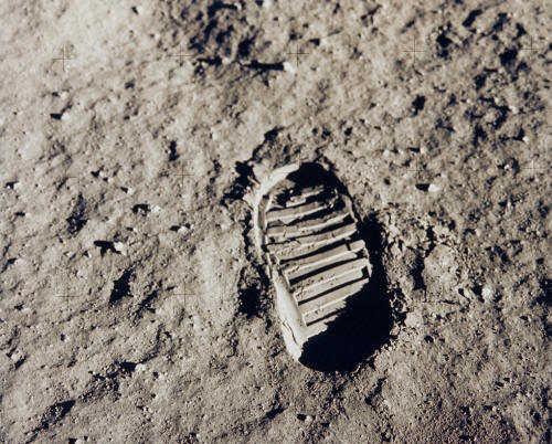 Neil Armstrong's first foot print on the moon.  The first time man visited another world.