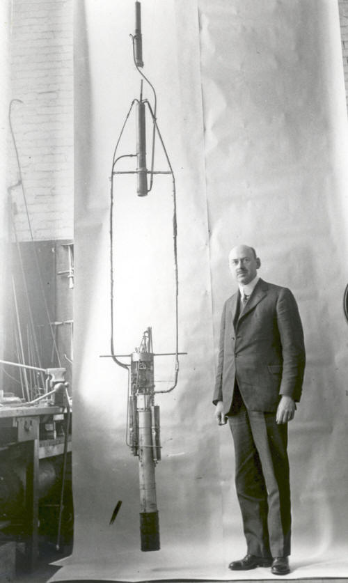 Robert Goddard with his Double Acting Engine Rocket in 1925
